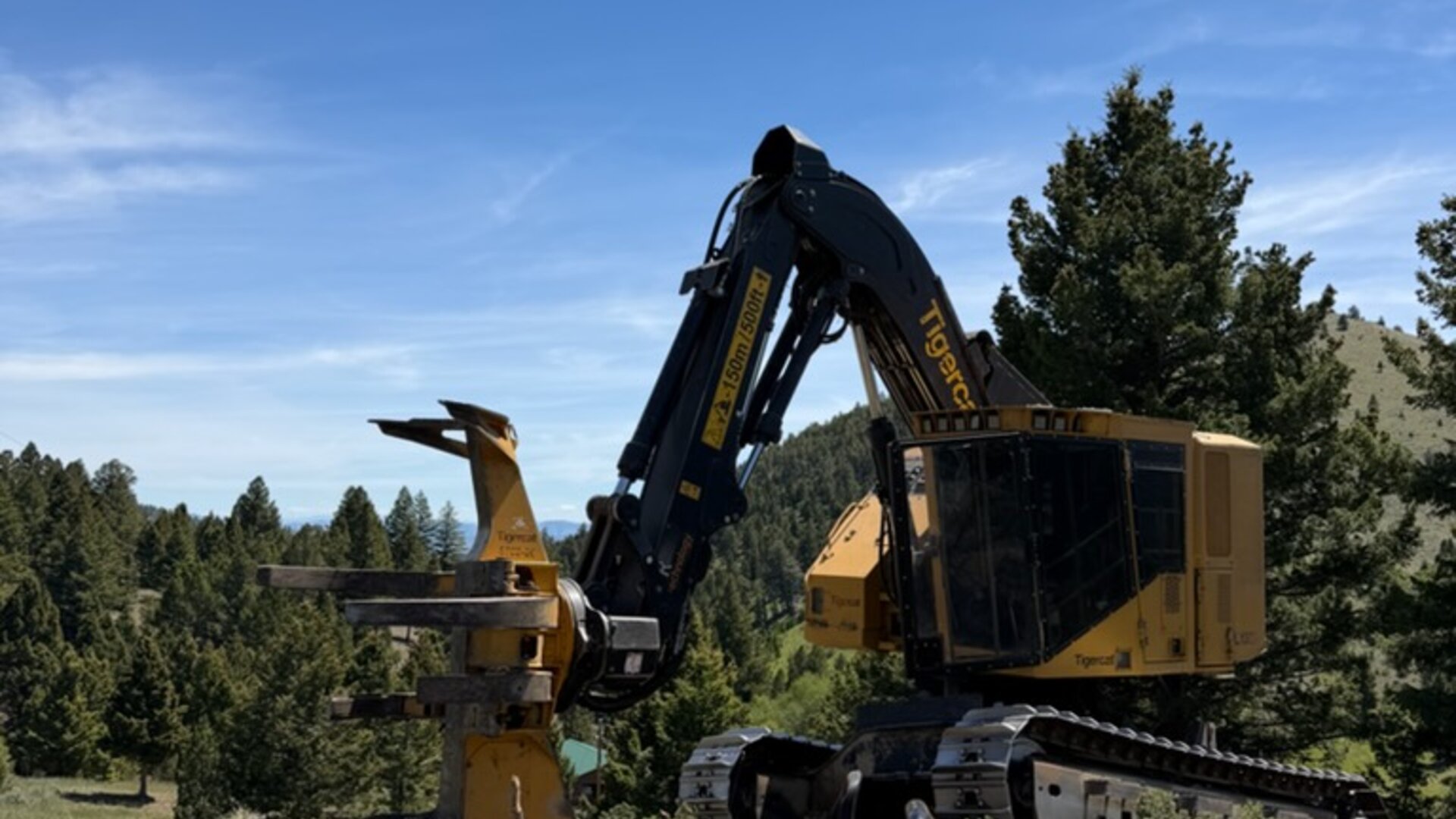 Over The Top's Tigercat equipment clearing overgrown acreage in Montana