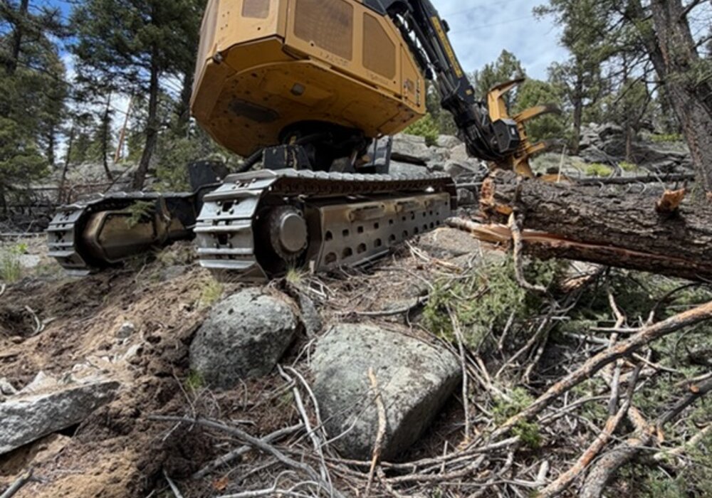 Over The Top's Tigercat equipment clearing a lot