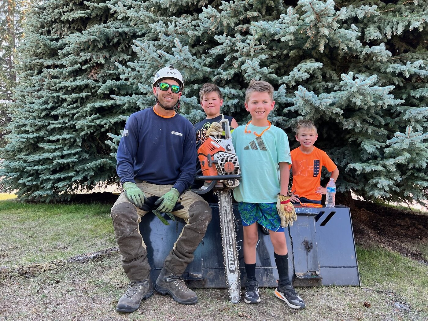 Jeremiah Roberts of Over The Top Tree Service with his family